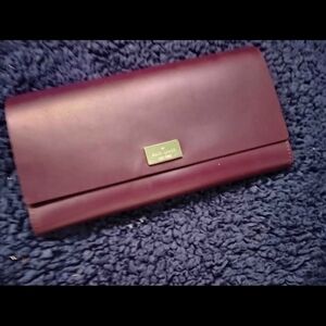 Eggplant colored Kate Spade New York Arbour Hill leather wallet